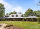 Charming home with a metal roof, wrap-around porch, and well-manicured lawn, great curb appeal at 1433 Kern Carlton Rd, Salisbury, NC 28146