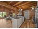 Spacious kitchen featuring an island with seating, wooden beams, and an open-concept design at 1433 Kern Carlton Rd, Salisbury, NC 28146