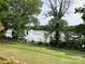 Picturesque lakeside view from the property, featuring a lush green lawn and a tranquil water scene at 1433 Kern Carlton Rd, Salisbury, NC 28146