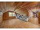 Spacious living room featuring wooden paneling, gray sofa, and plenty of natural light at 1433 Kern Carlton Rd, Salisbury, NC 28146