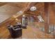 Lofted living room with wood paneled walls and ceilings, stone fireplace and leather furniture at 1433 Kern Carlton Rd, Salisbury, NC 28146