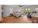 Light-filled main bedroom featuring hardwood floors, a sitting area, and large windows with scenic views at 1433 Kern Carlton Rd, Salisbury, NC 28146