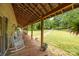 Inviting covered porch with rocking chairs, offering a relaxing outdoor space overlooking the beautiful yard at 1433 Kern Carlton Rd, Salisbury, NC 28146