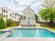 Inviting backyard with pool, spa, patio seating, and lush landscaping at 1600 Princeton Ave, Charlotte, NC 28209