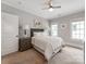 Comfortable bedroom features two large windows, carpet flooring, and simple design at 1600 Princeton Ave, Charlotte, NC 28209