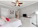 Charming bedroom with neutral walls, a ceiling fan, and a TV on the dresser at 1600 Princeton Ave, Charlotte, NC 28209
