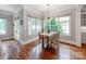 Sun-drenched breakfast nook area featuring a wood table and modern lighting at 1600 Princeton Ave, Charlotte, NC 28209