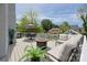 Spacious deck with an outdoor dining area, gas grill, and comfortable seating at 1600 Princeton Ave, Charlotte, NC 28209