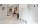 Welcoming entryway with marble floors, built in storage cubbies, and coat hooks at 1600 Princeton Ave, Charlotte, NC 28209