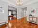 Stylish entryway with hardwood floors, elegant wallpaper, and views into other rooms at 1600 Princeton Ave, Charlotte, NC 28209
