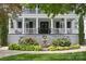 Charming entryway featuring a classic water fountain, vibrant flowerbeds, and a welcoming double door at 1600 Princeton Ave, Charlotte, NC 28209