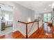 Upstairs hallway that offers seamless transition to bedrooms at 1600 Princeton Ave, Charlotte, NC 28209