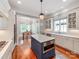Elegant kitchen boasts a center island, stainless appliances, and an open layout leading to the dining area at 1600 Princeton Ave, Charlotte, NC 28209