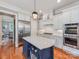 Gourmet kitchen boasts a center island, stainless appliances, and ample counter space at 1600 Princeton Ave, Charlotte, NC 28209