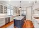 Modern kitchen featuring a large island, stainless steel appliances, and ample storage space at 1600 Princeton Ave, Charlotte, NC 28209