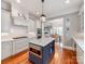 Stylish kitchen with a center island, stainless steel appliances, and seamless flow to other living spaces at 1600 Princeton Ave, Charlotte, NC 28209