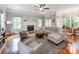 Bright living room with hardwood floors, fireplace, and comfortable seating arrangement at 1600 Princeton Ave, Charlotte, NC 28209