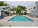 Relaxing backyard oasis with a rectangular pool, modern pool house, and comfortable lounge chairs at 1600 Princeton Ave, Charlotte, NC 28209