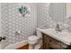 Stylish powder room boasts modern fixtures, elegant wallpaper, and a sleek vanity at 1600 Princeton Ave, Charlotte, NC 28209
