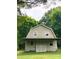 Rustic barn surrounded by lush greenery and trees at 1614 Statesville Blvd, Salisbury, NC 28144
