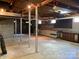 Basement featuring concrete walls and floors, exposed ceilings and support columns, and built-in storage at 1614 Statesville Blvd, Salisbury, NC 28144