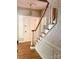 Elegant entryway featuring a hardwood staircase and decorative chandelier at 1614 Statesville Blvd, Salisbury, NC 28144