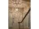 Elegant entryway featuring a hardwood staircase and decorative chandelier at 1614 Statesville Blvd, Salisbury, NC 28144