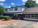 Spacious two-story house with a brick driveway and an attached garage at 1614 Statesville Blvd, Salisbury, NC 28144
