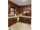 Cozy kitchen features wood cabinets, corner sink, and ample counter space at 1614 Statesville Blvd, Salisbury, NC 28144