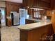 Spacious kitchen equipped with stainless steel refrigerator, plenty of cabinets and door to exterior at 1614 Statesville Blvd, Salisbury, NC 28144