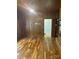 Spacious living room featuring hardwood floors, wood paneled walls and ample natural light at 1614 Statesville Blvd, Salisbury, NC 28144