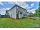 Expansive backyard with a lush lawn, patio area, and mature trees, perfect for recreation and relaxation at 166 Glenn Allen Rd, Mooresville, NC 28115