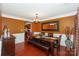 Dining room featuring warm wall color, modern chandelier and a large mirror at 166 Glenn Allen Rd, Mooresville, NC 28115