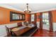 Dining room showcasing warm wall color, modern chandelier and two large windows at 166 Glenn Allen Rd, Mooresville, NC 28115