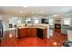Kitchen featuring dark cabinets, stainless steel appliances, and an open floor plan at 166 Glenn Allen Rd, Mooresville, NC 28115