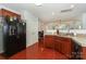 Kitchen with stainless steel refrigerator, updated appliances and wood floors at 166 Glenn Allen Rd, Mooresville, NC 28115