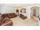 Bright living room featuring a comfortable sectional sofa and arched doorways to adjacent rooms at 166 Glenn Allen Rd, Mooresville, NC 28115