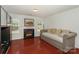 Bright living room with a fireplace, hardwood floors, and lots of natural light at 166 Glenn Allen Rd, Mooresville, NC 28115