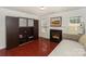 Bright living room with a fireplace, hardwood floors, and a storage unit at 166 Glenn Allen Rd, Mooresville, NC 28115