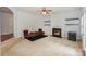 Open-concept living room with a fireplace and steps leading to another room at 166 Glenn Allen Rd, Mooresville, NC 28115