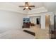 Spacious main bedroom featuring a tray ceiling, plush carpet, and an adjacent sitting area at 166 Glenn Allen Rd, Mooresville, NC 28115