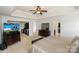 Open main bedroom featuring a tray ceiling, neutral decor, and access to a walk-in closet at 166 Glenn Allen Rd, Mooresville, NC 28115