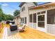 Exterior view of a wooden back deck with seating, offering a great outdoor entertainment space at 1730 Eden Glen Dr, Dallas, NC 28034