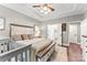 Nicely decorated bedroom featuring hardwood floors, a tray ceiling and access to a private bath at 1730 Eden Glen Dr, Dallas, NC 28034