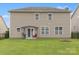Expansive backyard featuring a grill, patio seating under a pergola, and a grassy area at 1810 Kerwick Ct, Lancaster, SC 29720