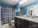 Full bathroom featuring a double sink with granite countertops, shower, and a toilet at 1810 Kerwick Ct, Lancaster, SC 29720