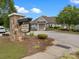 View of the community clubhouse featuring well-maintained landscaping and stone signage at 1810 Kerwick Ct, Lancaster, SC 29720