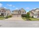 Inviting two-story home displays manicured lawn, stone accents, and double garage, set under a partly cloudy sky at 1810 Kerwick Ct, Lancaster, SC 29720