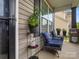 Welcoming front porch features comfortable seating, decorative plants, and charming accents, perfect for relaxing outdoors at 1810 Kerwick Ct, Lancaster, SC 29720
