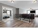 Open entryway leading to a living room, and a bedroom with hardwood floors and plenty of natural light at 1810 Kerwick Ct, Lancaster, SC 29720